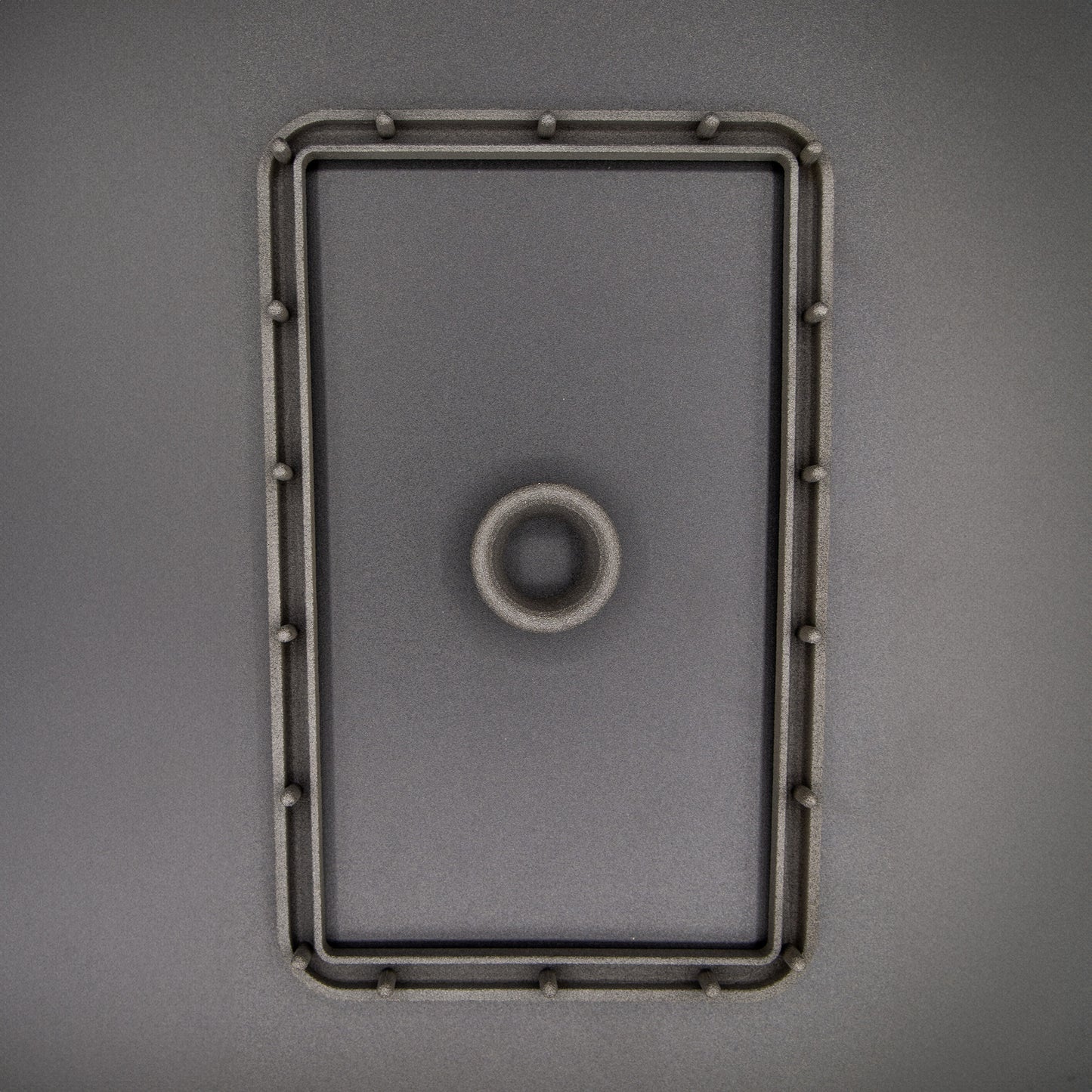 Nissan R31 Skyline manual shifter surround accessories, including the boot retaining plate and upper collar, designed to ensure the fabric boot can be fitted correctly.