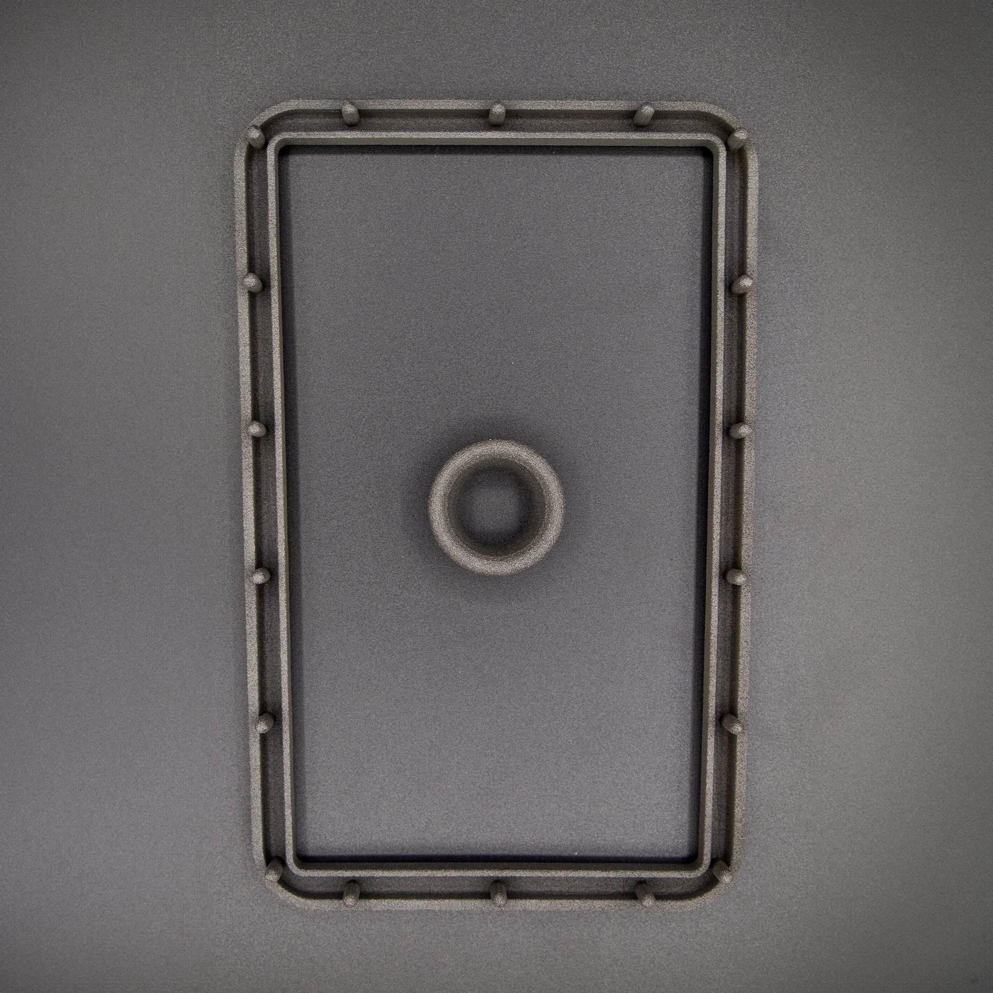 Nissan R31 Skyline manual shifter surround accessories, including the boot retaining plate and upper collar, designed to ensure the fabric boot can be fitted correctly.